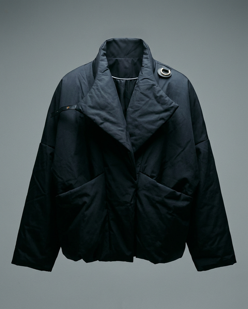 Black Padded Jacket, front view with the collar worn open as lapels, gold ring at the shoulder
