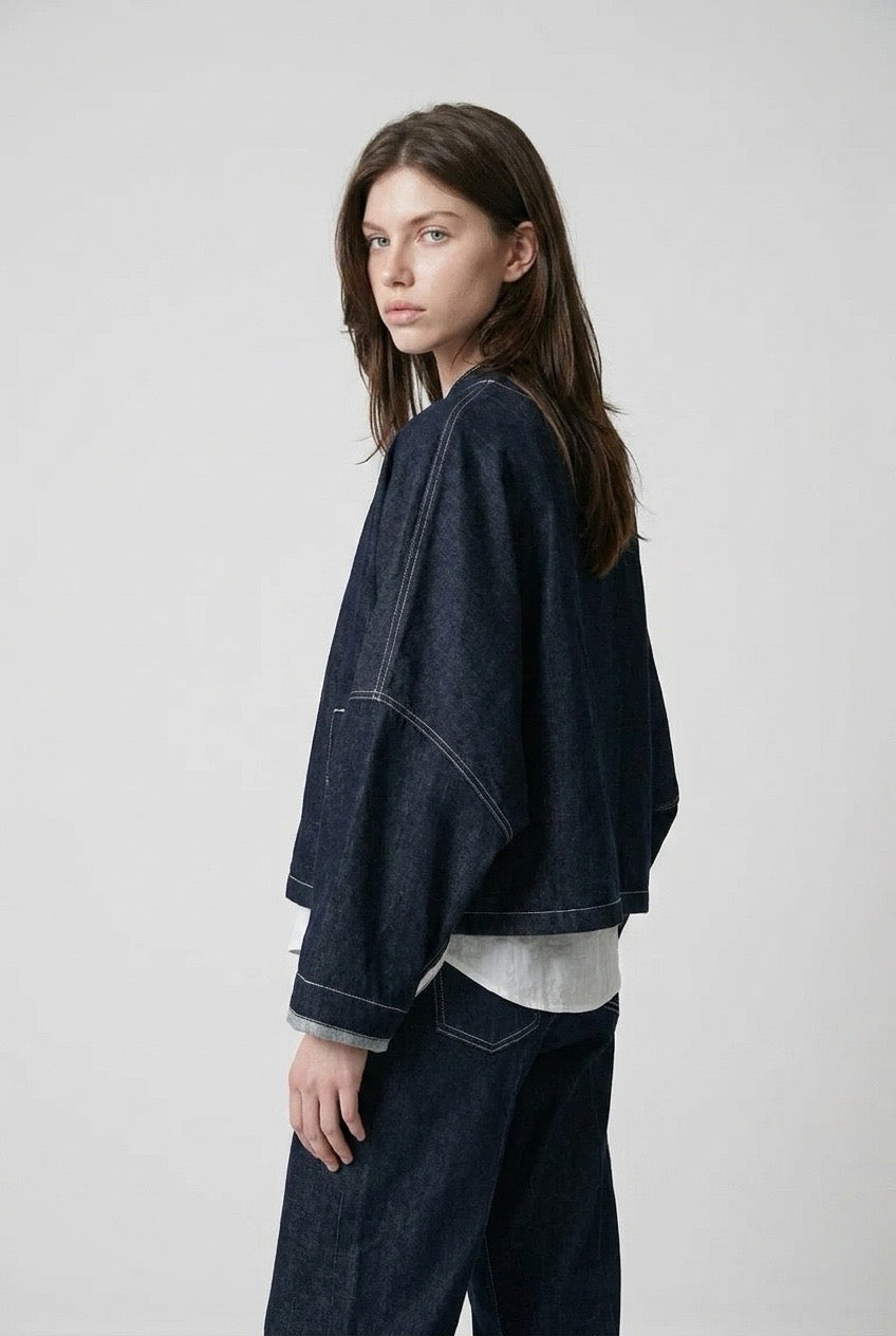 Side-back view of the jacket's oversized sleeve and cropped length