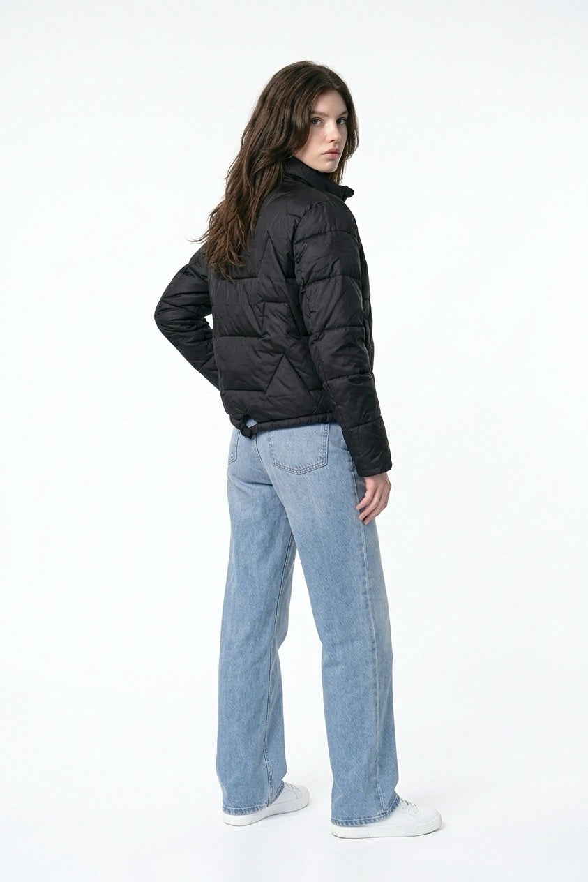 Black Diamond Light Down Jacket – three-quarter back view with light blue jeans