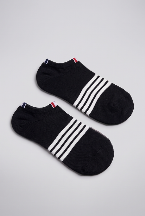 Black striped low-cut socks with white stripes across the foot, shown at an angle on light grey